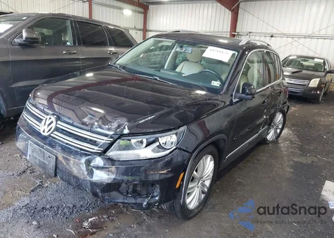 2014 Volkswagen Tiguan Sel z USA, uszkodzony, nr VIN WVGBV3AX0EW556316